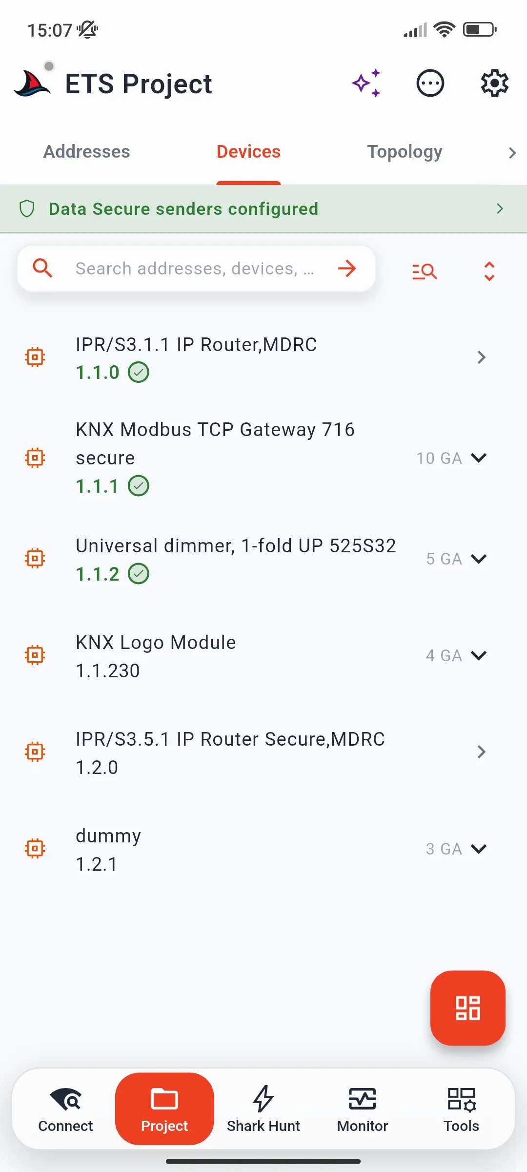 Devices tab listing devices with their addresses, download checks, and group address counts